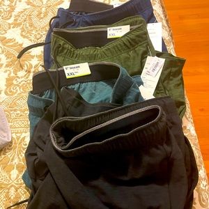 Four pairs of men's XXL tall activewear shorts.